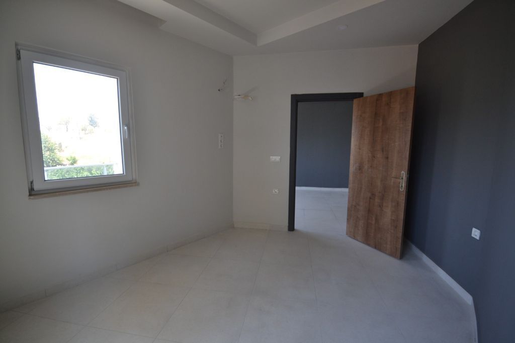 Новая квартира без мебели в районе Махмутлар