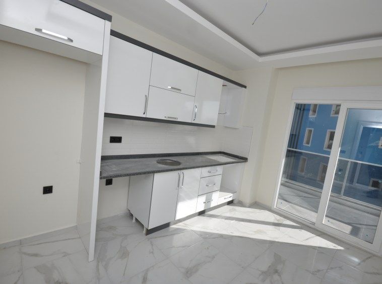 Новая квартира с отдельной кухней в Махмутларе