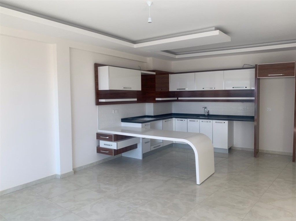 Новые квартиры 1+1 без мебели в Махмутларе